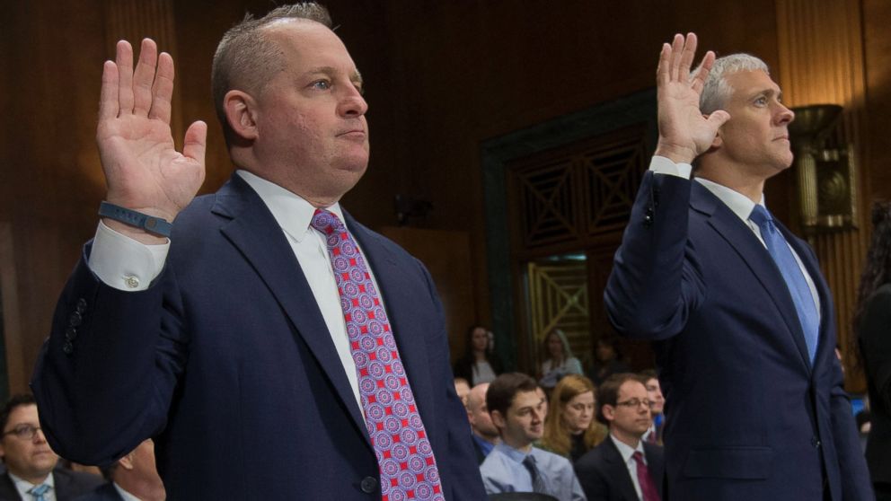 PHOTO: John J. Mulligan, left, executive Vice President and CFO of the Target Corporation, and, right, Michael R. Kingston, senior Vice President and CFO of the Neiman Marcus Group are sworn-in on Capitol Hill, Feb. 4, 2014, in Washington.