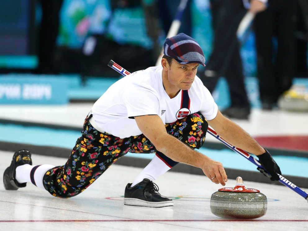 PHOTO: Norway skip Thomas Ulsrud, wearing rose-painting knickers and a patterned flat cap, delivers the stone during curling training at the 2014 Winter Olympics, Feb. 8, 2014, in Sochi, Russia.