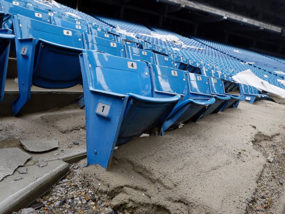 PHOTO: Foundation sand from cracked cement covers seats inside the Pontiac Silverdome in Pontiac, Mich. in this May 12, 2014 photo.