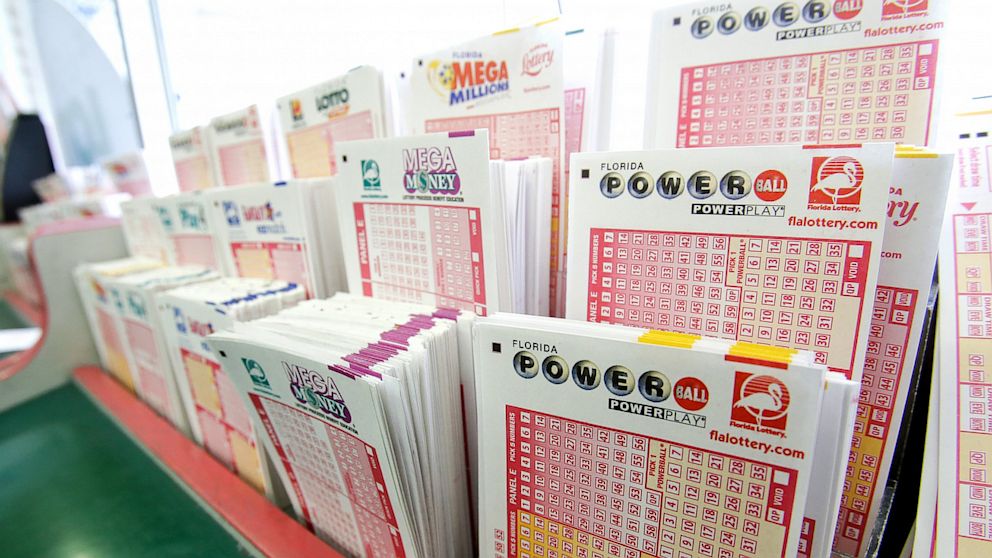PHOTO: Powerball tickets, right, along with other lotto tickets are seen May 16, 2013, at a convenience store in Orlando, Fla.