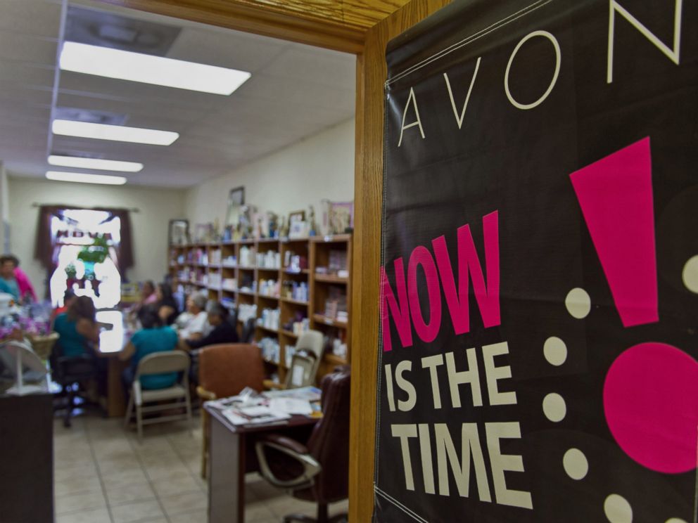 PHOTO: Avon Products Inc. signage is displayed on a door during a weekly sales meeting on Aug. 28, 2014 in McAllen, Texas.