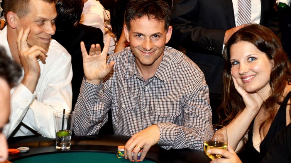 PHOTO: PHOTO: David Einhorn, center, president of Greenlight Capital Inc., attended the fourth annual Take Em To School Poker Tournament in New York, U.S., in this July 23, 2013, file photo.