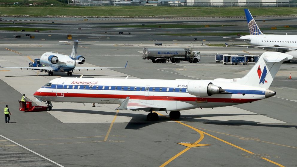 PHOTO: An American Airlines jet taxis on the runway at Laguardia Airport, Aug. 14, 2013, in New York.