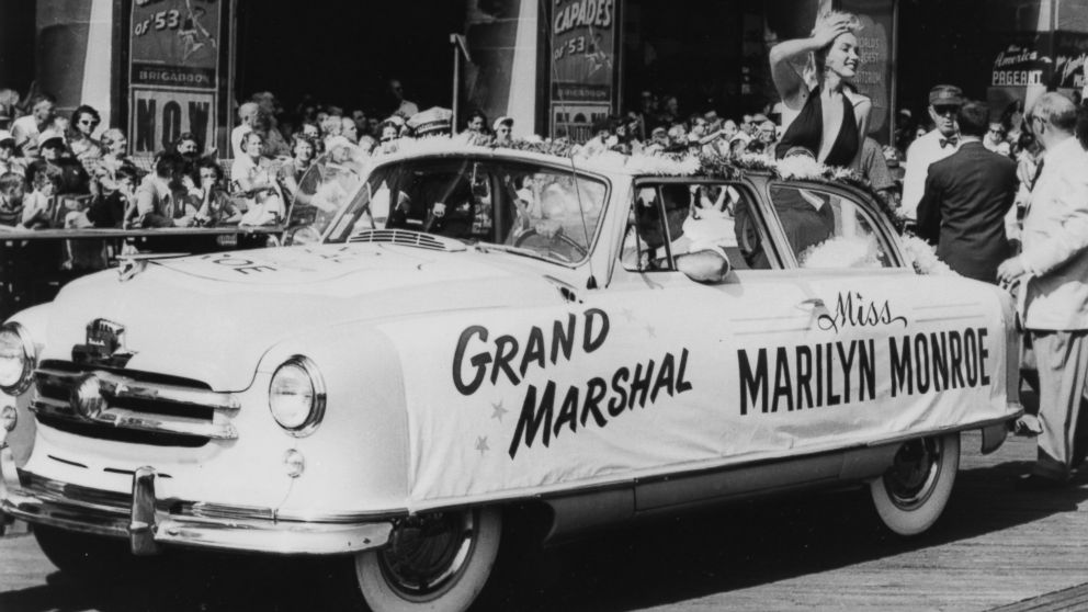 PHOTO: Marilyn Monroe plays grand marshal as she rides on the back of a convertible down the boardwalk during the Miss America Beauty Pageant parade, Sept. 1, 1952, in Atlantic City, N.J.