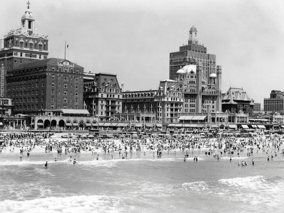 PHOTO: A crowded beach is seen with the boardwalk and hotels of Atlantic City, N.J. in the background, circa 1940s.