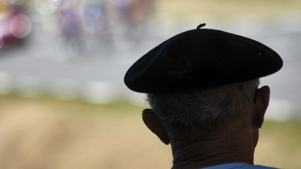 PHOTO: A cycling supporter wearing a beret watches the breakaway leaders during the 17th stage of the 94th Tour de France cycling race in this July 26, 2007, file photo.