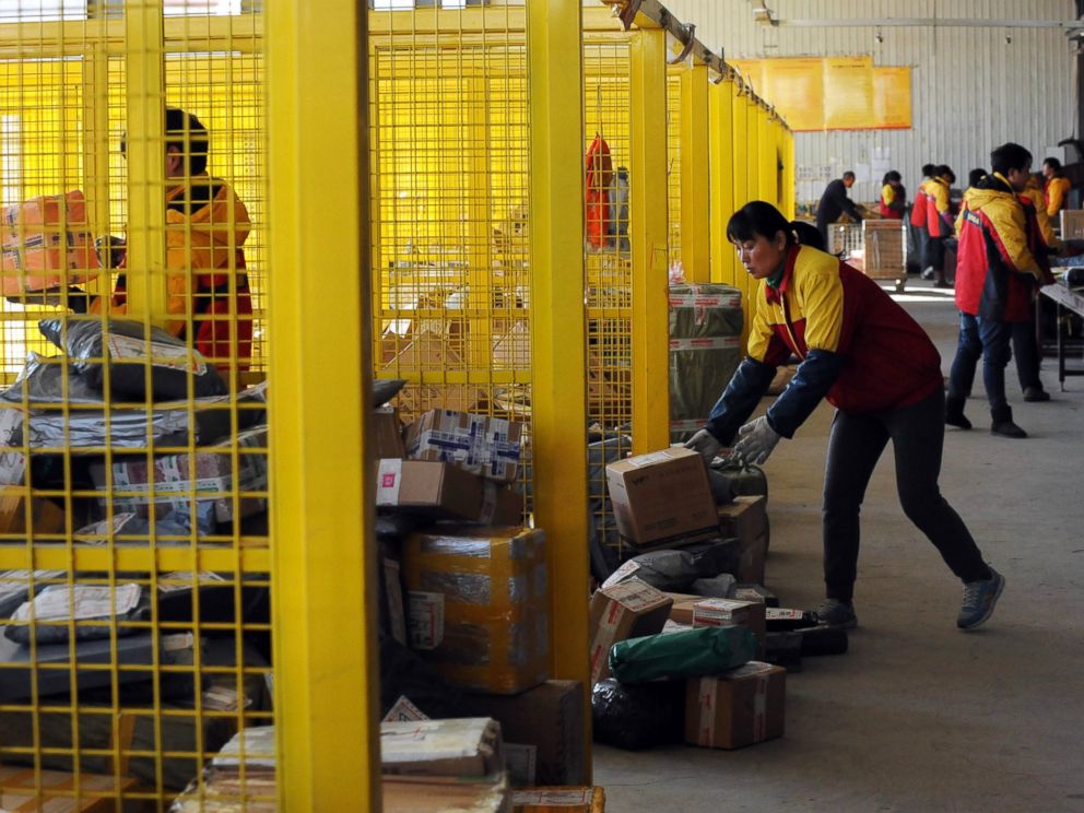 PHOTO: Workers sort out packages at an express delivery company in Beijing, Nov. 12, 2013, after Singles Day e-tailer festival on Nov. 11.
