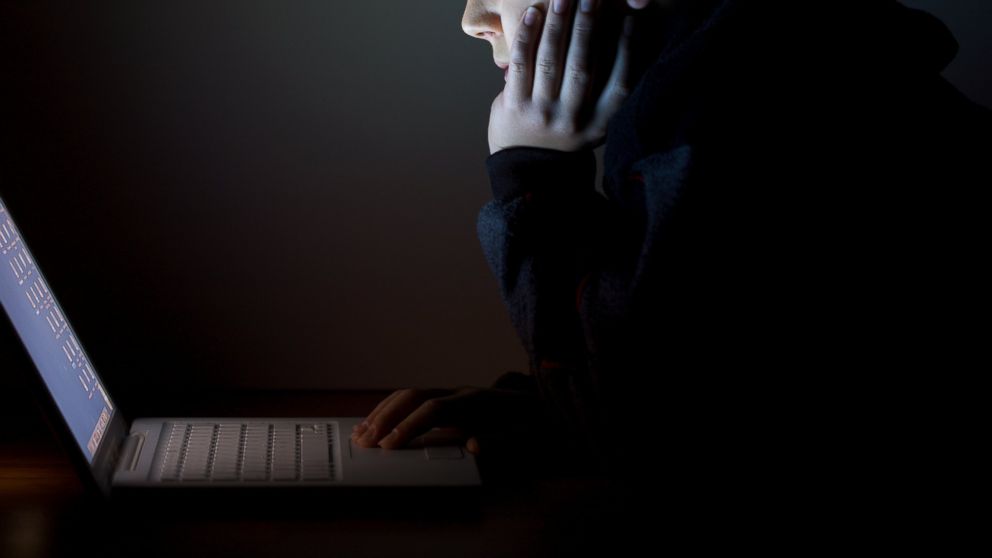 PHOTO: A man at a laptop.
