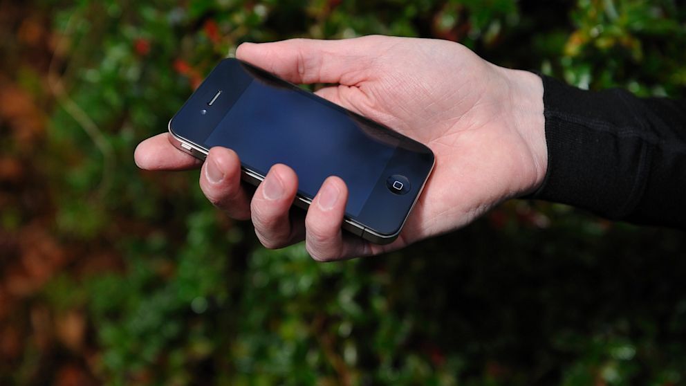 PHOTO: A man holds an Apple iPhone 4, Dec. 16, 2010.