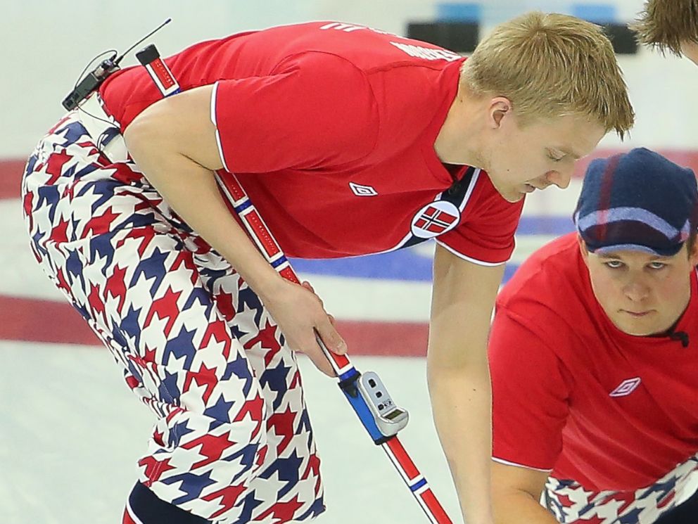 PHOTO: Haavard Vad Petersson, Christoffer Svae and Torger Nergaard of Norway compete in the curling mens round robin match between Norway and Germany during day five of the Sochi 2014 Winter Olympics, Feb. 12, 2014, in Sochi, Russia.