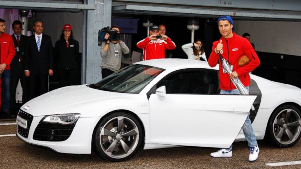 PHOTO: Real Madrid player Cristiano Ronaldo receives the keys of the new Audi car during the presentation of Real Madrids new cars made by Audi at the Jarama racetrack in this Nov. 8, 2012, file photo in Madrid, Spain. 