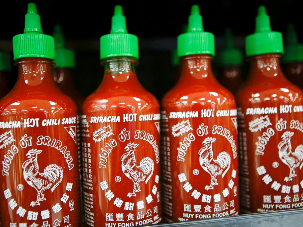 PHOTO: Huy Fong Foods Inc. Sriracha sauce is displayed for sale during the grand opening of a Wal-Mart Stores Inc. location in the Chinatown neighborhood of Los Angeles, Calif. Sept. 19, 2013.