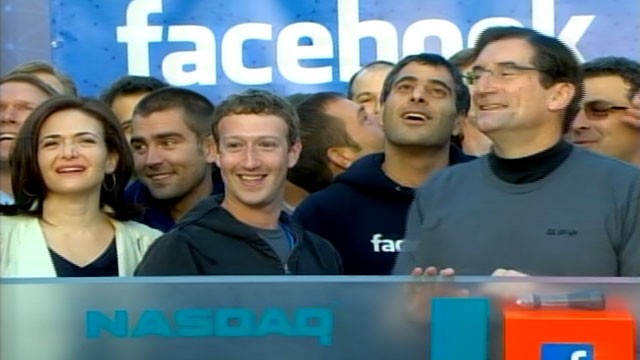PHOTO: Mark Zuckerberg, CEO and founder of Facebook, and COO Sheryl Sandberg gathered with a throng of cheering employees at the company headquarters in Menlo Park, Calif. to ring the stock market's opening bell.