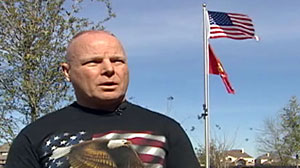 Photo: Former Marine in dispute over flag pole Former Marine stands by "official" display of American flag: Homeowners association encourages flag flying with restrictions