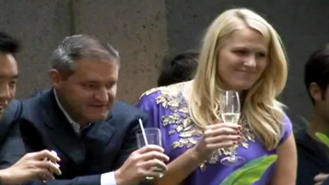 VIDEO: People sip champagne as hundreds of protesters march on Wall Street.