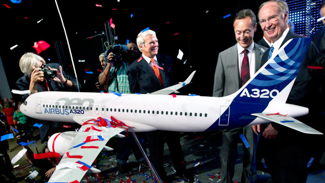 PHOTO: Alabama Gov. Robert Bentley, right, and Airbus President & CEO Fabrice Bregier celebrate the announcement that Airbus will establish its first assembly plant in the United States in Mobile, Ala., July 2, 2012.