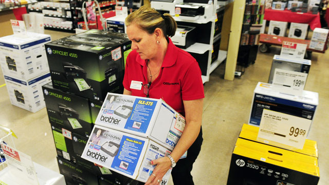PHOTO: Office Depot Customer Service Specialist Cindy Carmichael arranges merchandise for the Black Friday sale on Nov. 21, 2012 in Abilene, Texas.