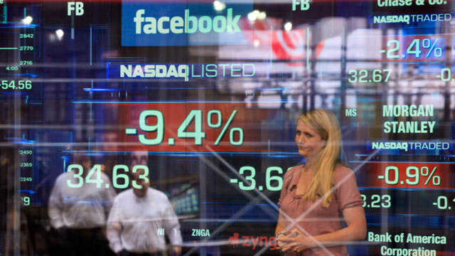 PHOTO: Television correspondent Sabrina Quagliozzi reports from inside the Nasdaq MarketSite in New Yorks Times Square, May 21, 2012.