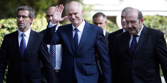 PHOTO: Outgoing Prime Minister George Papandreou leaves the presidential palace in Athens on Nov. 10, 2011.