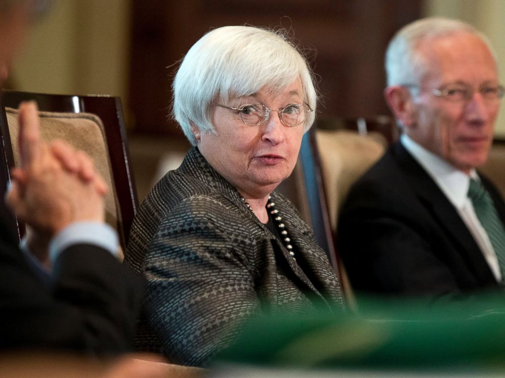 PHOTO: Federal Reserve Chair Janet Yellen, from left, with Vice Chairman Stanley Fischer, and the board of governors of the Federal Reserve System, presides over a meeting in Washington on July 20, 2015.