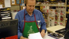 PHOTO: Larry Boutilier, hardware manager, who has been with the Minot, N.D. Menards since 1996, looks over paperwork at the store on Nov. 29, 2012; The home improvement retailer says it will hire workers from its home base in Wisconsin and fly them to Nor