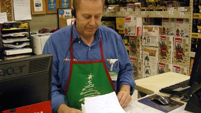 PHOTO: Larry Boutilier, hardware manager, who has been with the Minot, N.D. Menards since 1996, looks over paperwork at the store on Nov. 29, 2012; The home improvement retailer says it will hire workers from its home base in Wisconsin and fly them to Nor