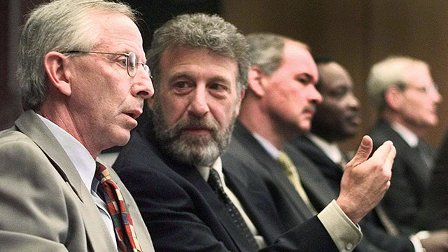 PHOTO: In this May 6, 1999 file photo, George Zimmer, second from left, gestures to Andy Dolich prior to a meeting, in Oakland, Calif.