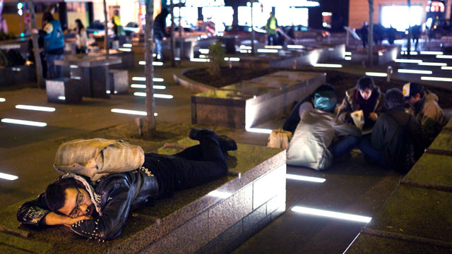 PHOTO: An Occupy Wall Street protestor rests in a newly tent-free Zuccotti Park during the early morning hours, Nov. 16, 2011, in New York.