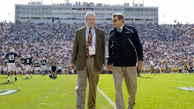 PHOTO: In this Oct. 8, 2011, file photo Penn State president Graham Spanier, left, and head football coach Joe Paterno chat before an NCAA college football game.