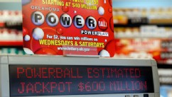 PHOTO: A sign at a store advertises the Powerball Lottery in Oklahoma City, Friday, May 17, 2013.
