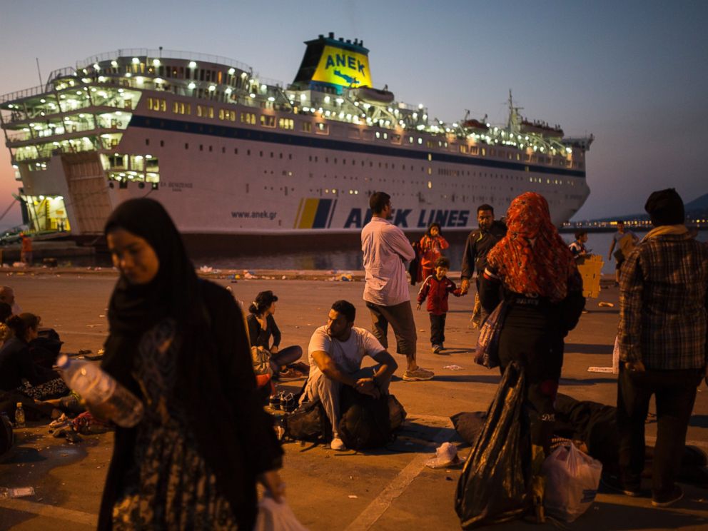 PHOTO: Migrants and refugees wait to be registered by police at the port of Mytilene, on the Greek island of Lesbos, Sept. 6, 2015. 