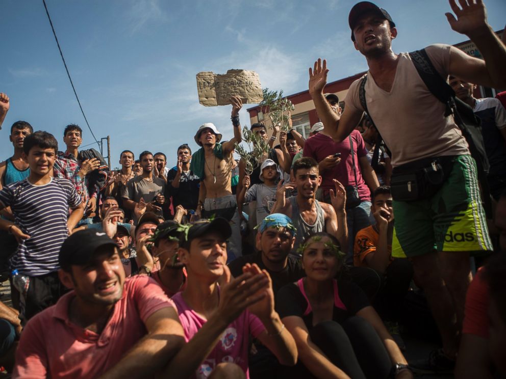 PHOTO: Refugees and migrants take part in a protest to demand faster processing by local authorities of their registration and the issuing of travel documents, at the port of Mytilene, on the northeastern Greek island of Lesbos, Sept. 7, 2015. 
