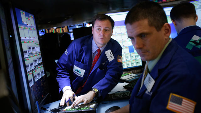 PHOTO: Traders work on the floor at the New York Stock Exchange in New York, Jan. 2, 2013.