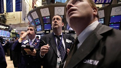 Traders work on the floor of the New York Stock Exchange, Nov. 21, 2011.