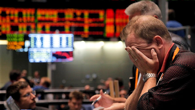 PHOTO: In this Aug. 8, 2011 file photo, trader Andrew Stavros reacts after the close of trading in the NASDAQ, 100 Index pit, on the floor of The CME Group in Chicago.