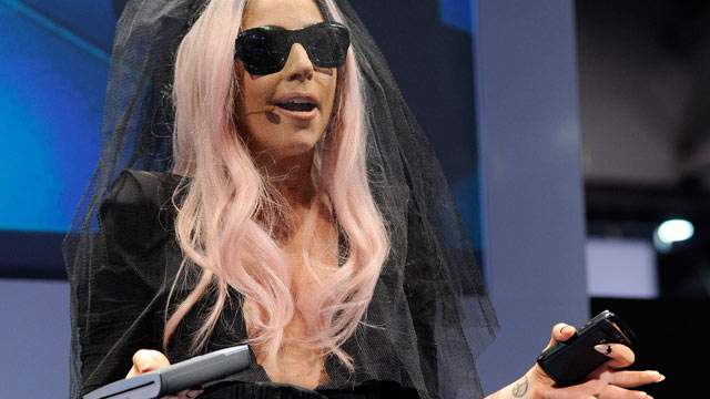 PHOTO: Recording artist Lady Gaga displays the Polaroid GL10 Instant Mobile Printer as she unveils the Polaroid Grey Label of products she co-designed at the 2011 International Consumer Electronics Show at the Las Vegas Convention Center January 6, 2011 i