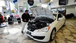 PHOTO: Workers move a 2011 Hyundai Genesis Coupe car for display in the showroom of the Hyundai dealership, in this Jan. 5, 2011 file photo, in Glendale, Calif.