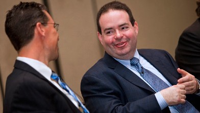 PHOTO: Marc Casper, president and chief executive officer of Thermo Fisher Scientific Inc., right, speaks with Greg Herrema, the company's senior vice president, during a press conference at the Pittcon 2010 Exposition in Orlando, Florida, U.S., on March,