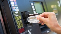 PHOTO: Woman pays for gas with credit card