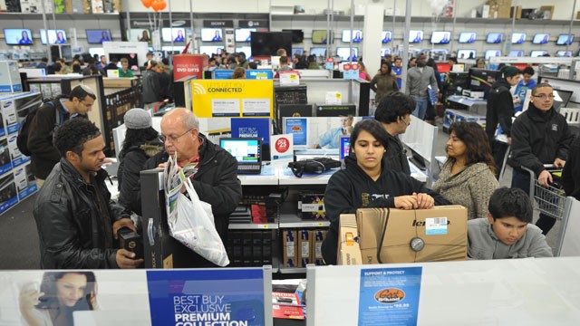 PHOTO: Shoppers look at laptop computers inside a Best Buy store which began their Black Friday sale at midnight on Nov. 22, 2012 in Rockville, Md.