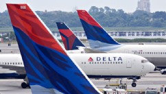 PHOTO: A Delta Air Lines plane taxis toward a gate between other Delta planes at John F. Kennedy International Airport in New York, U.S., on July 20, 2009.