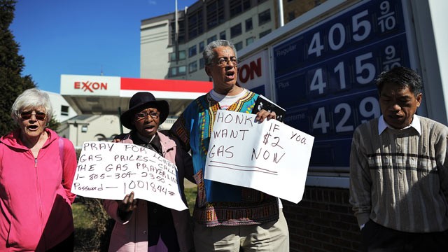 PHOTO: Demonstrators take part in a pray vigil for lower gasoline price in front of a service station in Washington, DC, February 23, 2012.