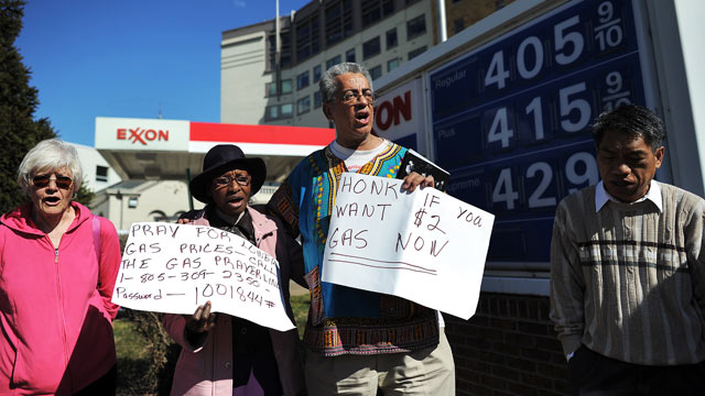 PHOTO: Demonstrators take part in a pray vigil for lower gasoline price in front of a service station in Washington, DC, February 23, 2012.