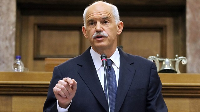 PHOTO: Greek Prime Minister George Papandreou gestures during his speech to the Panhellenic Socialist Movement (PASOK) parliamentary group at the Greek parliament in Athens, Oct. 31, 2011.
