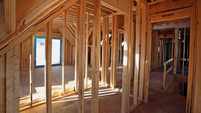 PHOTO: Framing studs stand inside of a new home under construction in Park Ridge, Illinois, U.S., on Nov. 28, 2012.