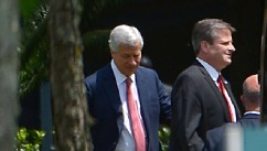 PHOTO: Jamie Dimon, chairman and CEO of JPMorgan Chase, left, and an unidentified man leave the company's annual shareholders meeting in Tampa, Fla., May 21, 2013.
