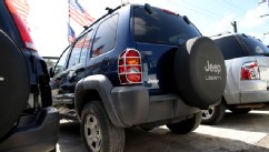PHOTO: A pre-owned Chrysler Jeep Liberty from 2002 is seen on the sales lot at Prestige Auto Boutique on June 18, 2013 in Hollywood, Fla.