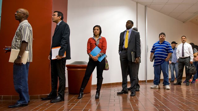 PHOTO: Job seekers wait for the opening of an employment fair sponsored by Job News in partnership with USOilWorker.com and The Texas Veterans Commission at the Norris Conference Center in San Antonio, Texas, March 19, 2013.