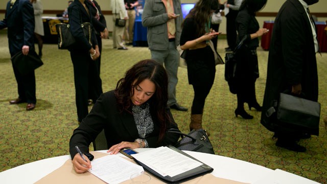 PHOTO: Veronica Floyd fills out a job application at a National Career Fairs job fair in Arlington, Va., Jan. 30, 2013.