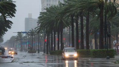 PHOTO: A vehicle travels down Canal Street as Hurricane Isaac dumps heavy rain on August 29, 2012 in New Orleans, La.